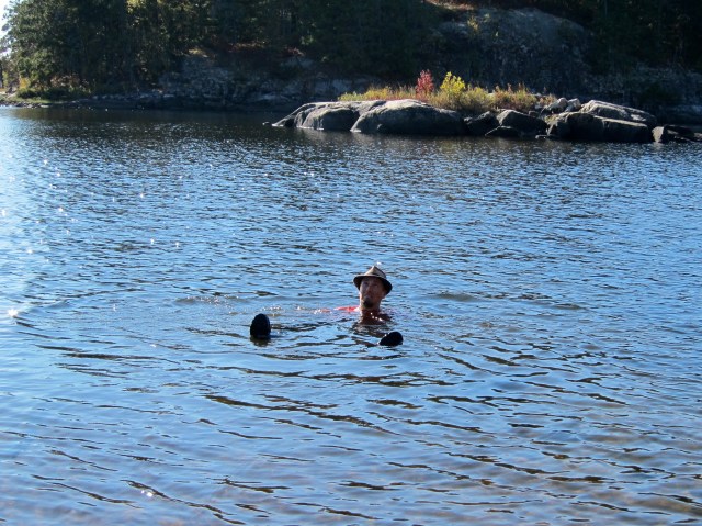 Bathing with shoes and hat on! 